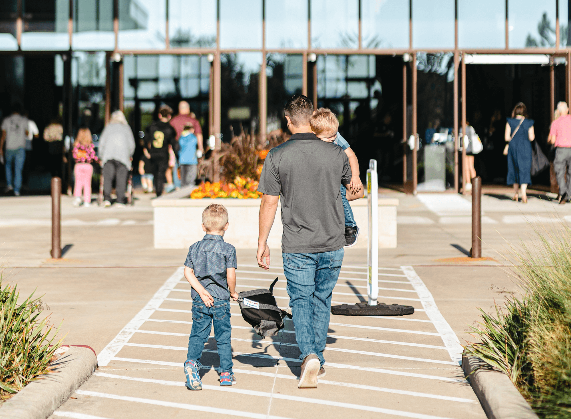 Man walking his kids into church